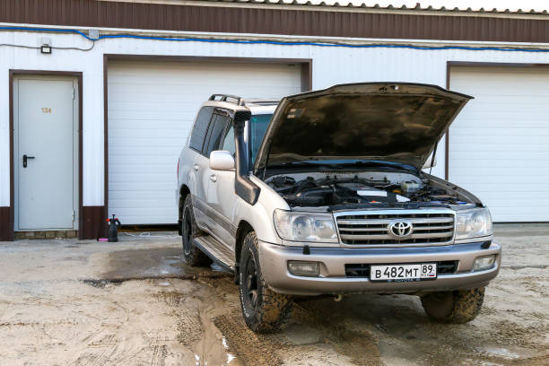 Novyy Urengoy, Russia - June 29, 2023: Offroad car Toyota Land Cruiser 100 near the garage.
