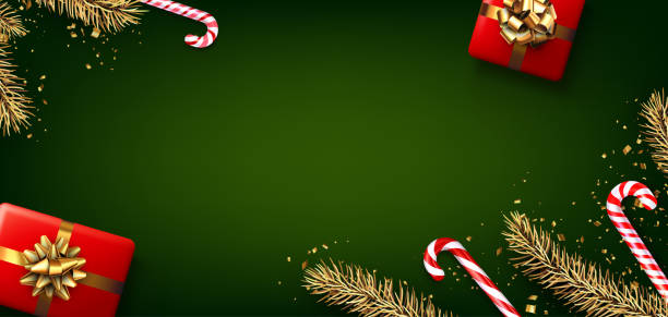 istock Festive Green Holiday Background with Gifts and Candy Canes 2189963852