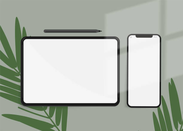 istock Phone and tablet with palm leaves on a green background 2189965037