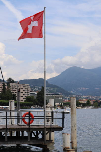 istock Lugano lake panorama with Swiss national flag 2189969901
