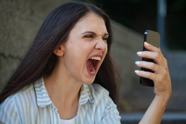 istock Angry young woman talking on the phone 2189972540