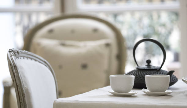 An Elegant Tea Setting in a Cozy Cafe, perfectly capturing a serene and inviting ambiance
