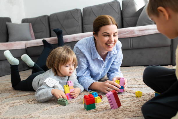 istock Mom and children bonding through play 2189978291
