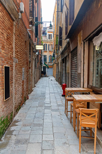 istock Narrow cobble street in Venice 2189981204