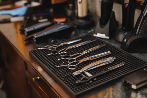 istock A barber shop with scissors and other tools on a counter 2189982573