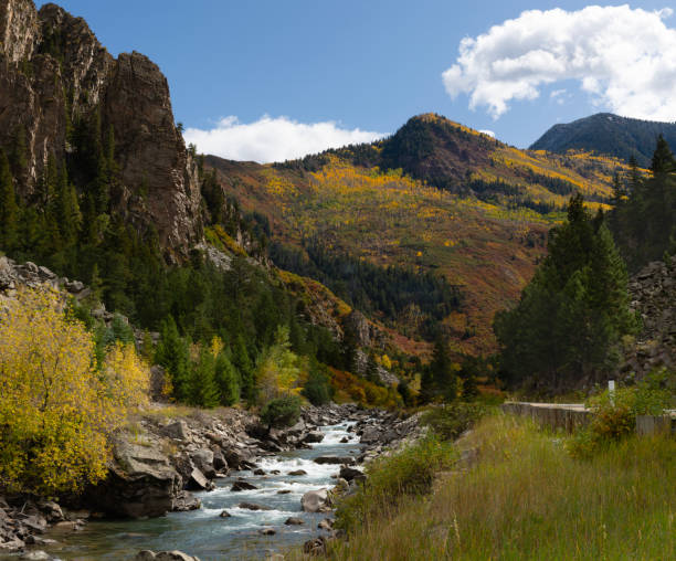 This view of the Crystal River and the Elk Mountains features bright fall foliage, including the yellow aspen leaves for which this area of Colorado is known.