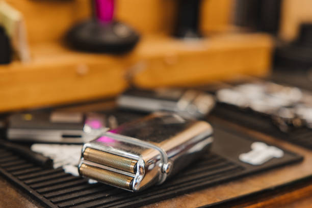istock A silver razor sits on a table next to a pair of scissors 2189986451