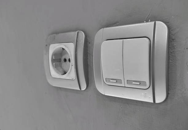 istock electrical plugs and switches on building walls 2189988257