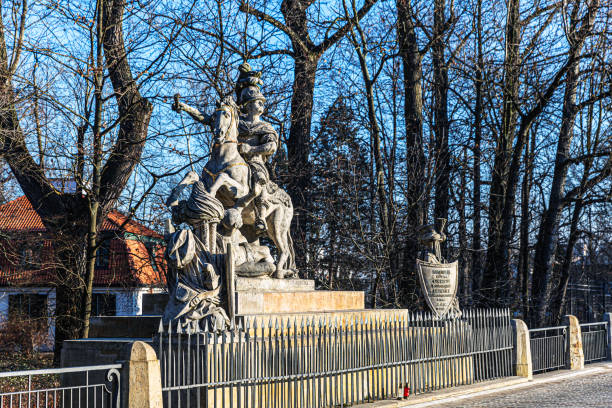 Warsaw, Poland - December 1, 2018: This striking equestrian statue in Warsaw’s Lazienki Park pays tribute to historical valor and strength. Surrounded by natural beauty, the intricately sculpted monument stands as a symbol of heroism, blending art and history within the park’s serene landscape.
