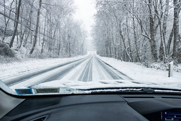 istock Winter Lake Effect Snow Down Hill Highway Driving 2189988567