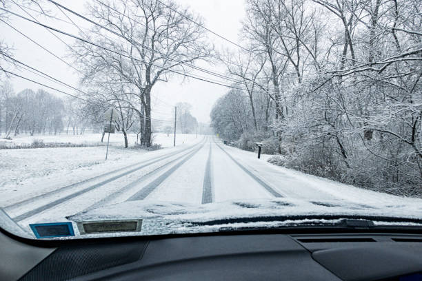 istock Slippery Untreated Rural Highway During Blizzard Snow Storm 2189988597