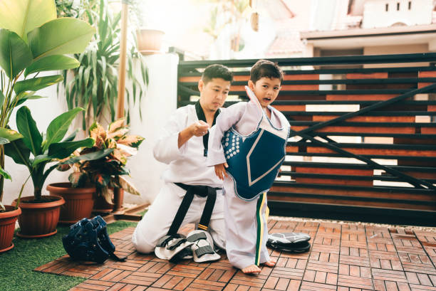 istock Children preparing for martial art with father 2189991974