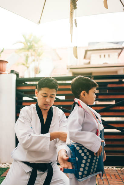 istock Children preparing for martial art with father 2189992009