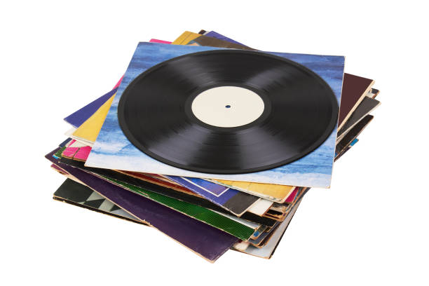 istock Vinyl record on a stack paper envelopes. Analog sound. Classic audio. Isolated on white 2189993112