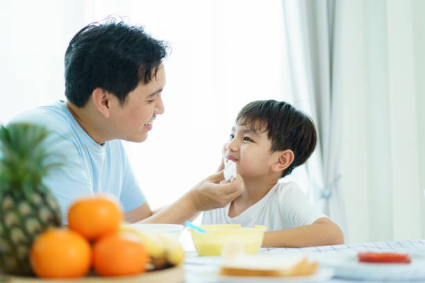 istock Father and son making a breakfast together. 2189997210