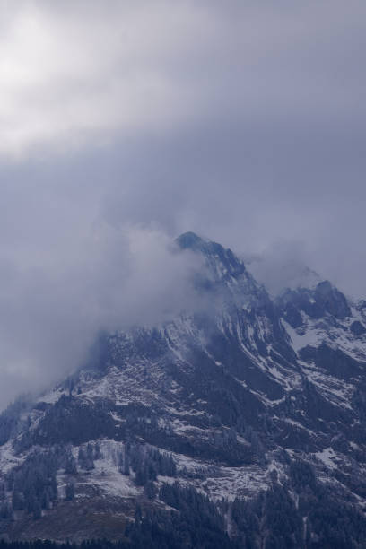 Majestic snowy landscape on a mountain slope. Winter scene with serene snow-covered hills. Ideal for nature and winter-themed projects.K
