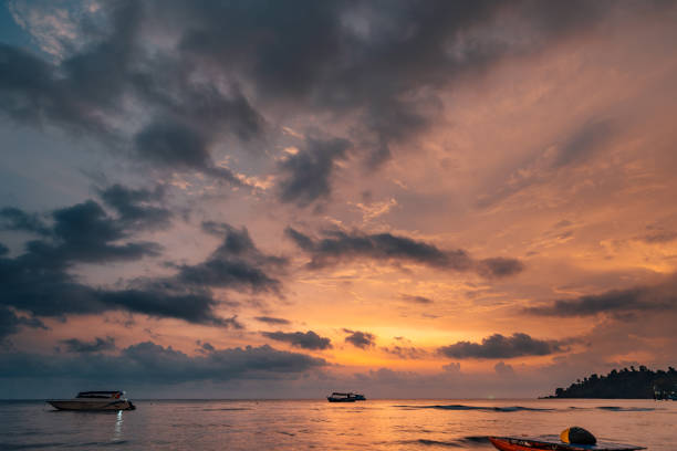 Beautiful sunset above the ocean on tropical beach in Asia