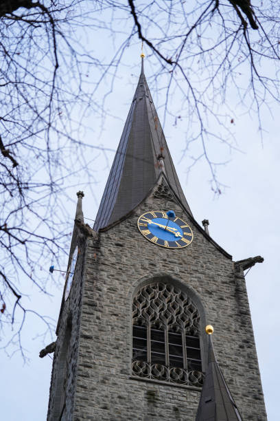 istock Historic Clock Tower with Gothic Architecture Against Cloudy Sky 2190004244