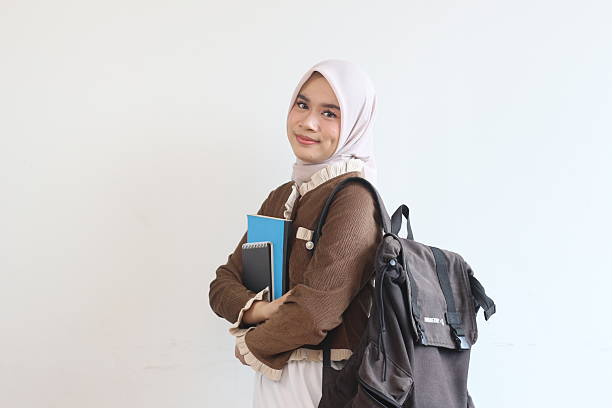 istock A Smiling Muslim Female Student with Backpack and Books Ready for Class 2190006163