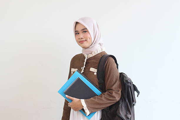 istock A Smiling Muslim Student Girl with Backpack and Books Ready for Class 2190006288