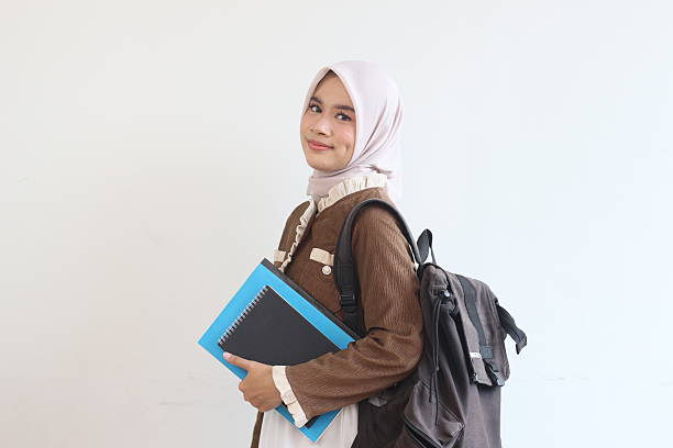 istock Smiling Muslim Student Girl with Backpack and Books Ready for Class 2190006338