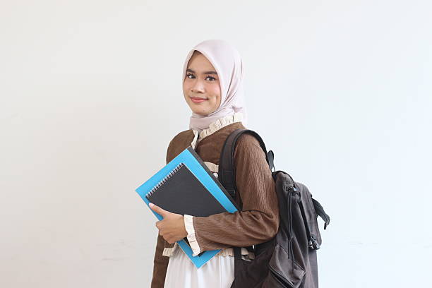 istock Smiling Muslim Student Girl with Backpack and Notebooks Ready for Class 2190006613