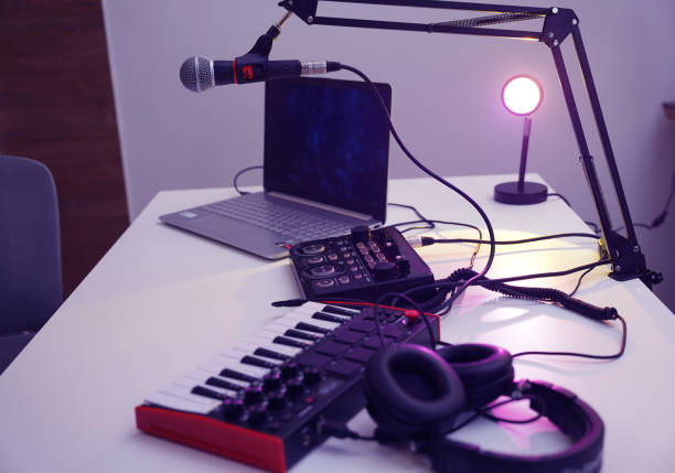 istock Beautiful young singer and musician broadcast from her home studio 2190008041