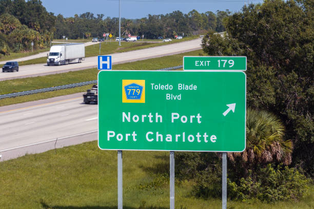 istock Highway interchange exit sign with direction to North Port and Port Charlotte in Florida. Interstate freeway travel in USA 2190008138