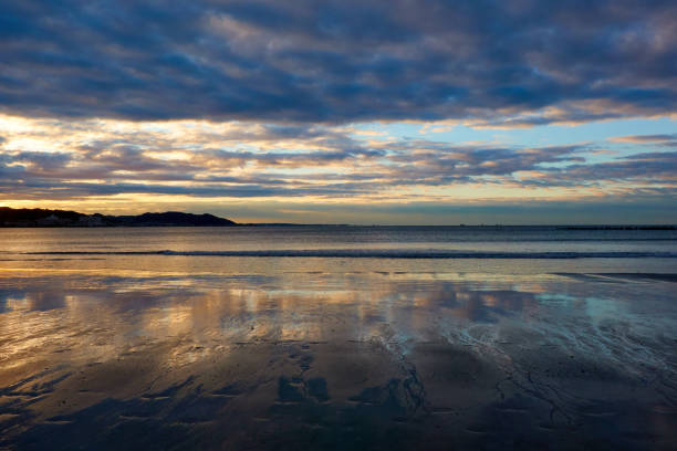 istock Scenic view of beach agasint dramtic sky during sunrise 2190010580