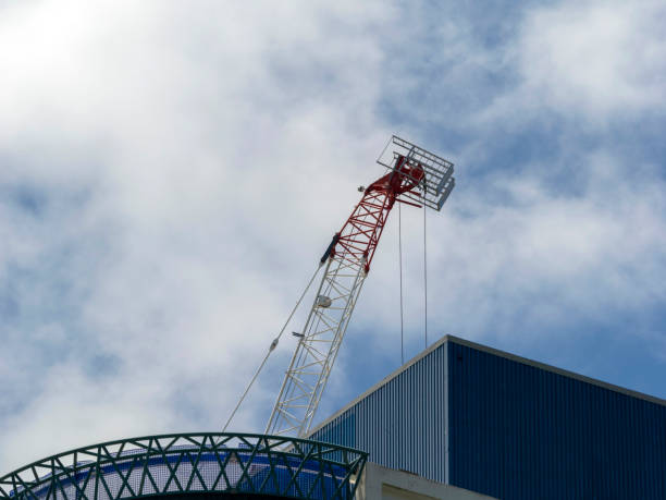 A crane is being operated at the construction site.