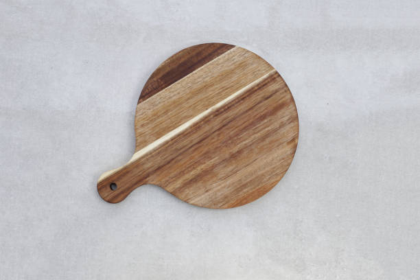 istock Wooden cutting board on grey background. 2190013238
