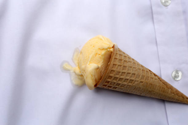 Iice cream with waffle cone on a white shirt, dirty stain