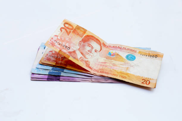 istock Philippine money, Banknotes on white 2190014771