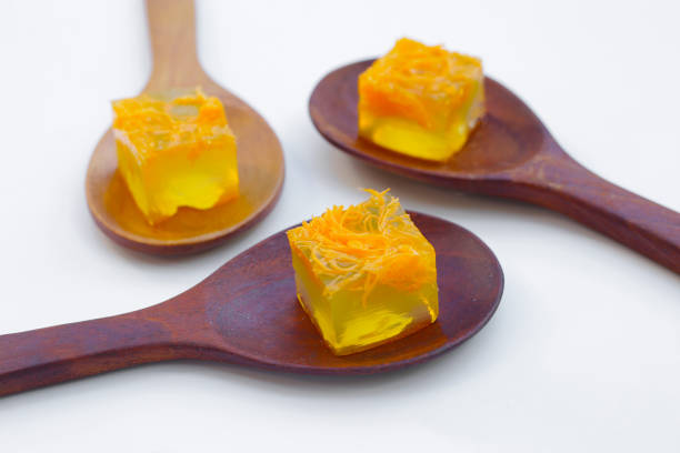 Yellow slices of marmalade isolated on white background