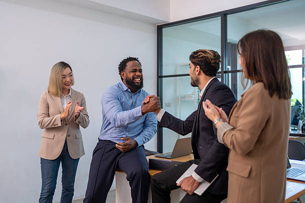 istock business men doing hands shake for the future business cooperation,multiracial business partnership meeting in the office room 2190016961