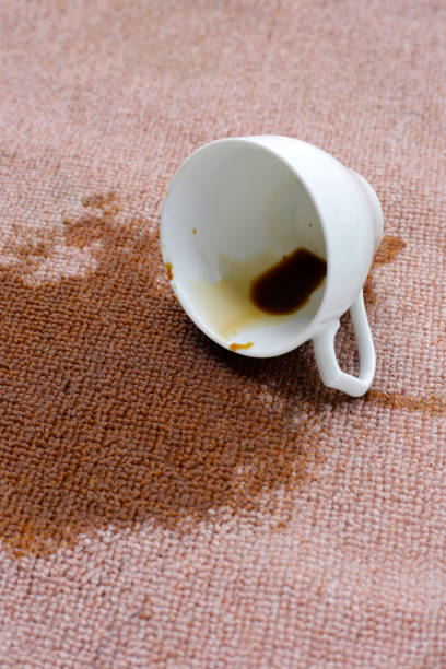 istock Coffee spilled from white cup on the carpet 2190018824