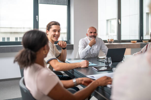 istock Confident Caucasian Manager Leading Discussion with Diverse Team 2190019721
