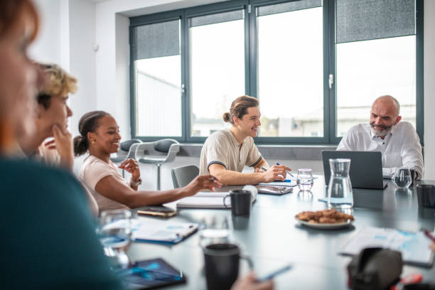 istock Energetic Diverse Professionals Collaborate in Modern Office Meeting 2190019730