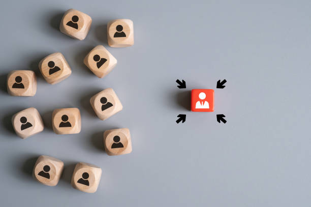 istock Cube with business person icon on red cube spot with focus arrow. Leadership concept that employee got promotion in career. Human resource that search for talent employee with successful career. 2190023886