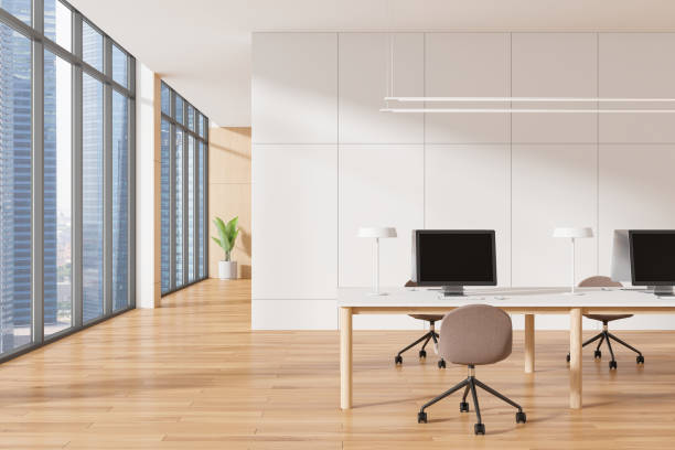 istock Office interior with desks and computers, modern style, large windows, bright wooden floor, concept of business workspace. 3D Rendering 2190024931