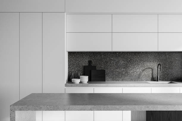 istock Minimalistic modern kitchen interior with white cabinets and dark backsplash design concept. 3D Rendering 2190025102