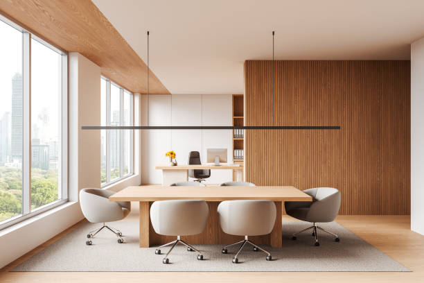 istock Wooden office interior with work desk, meeting zone and panoramic window 2190025152