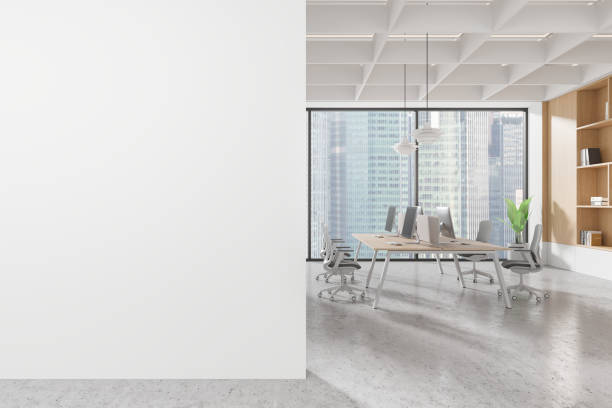 istock Blank white wall mockup in modern office with large windows and city view in background. 3D Rendering 2190025226