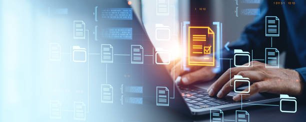 istock Businessman typing on laptop keyboard, document management system hologram 2190025584