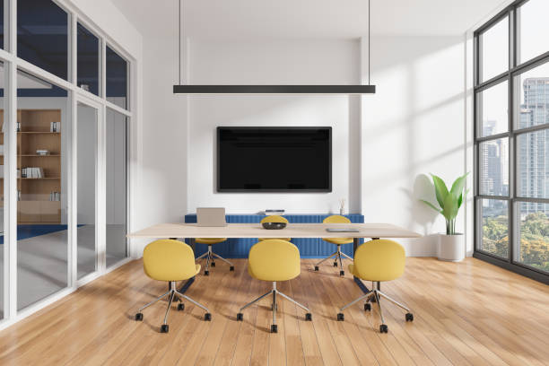 istock Modern office conference room with yellow chairs, large screen, and city view through windows. 3D Rendering 2190025871