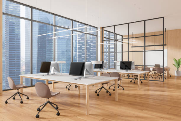 istock Spacious modern office interior with computers, wooden floors, large windows showing cityscape. Concept of corporate business. 3D Rendering 2190025975