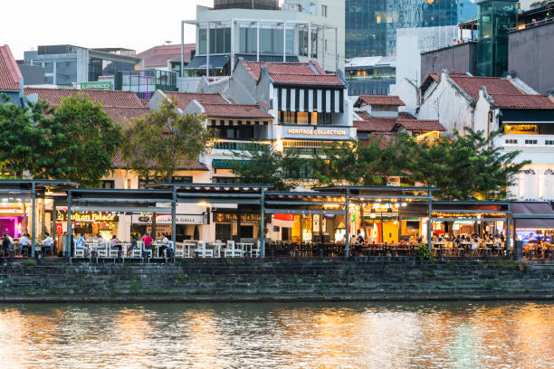 Singapore- July 17, 2024: Building view of the Boat Quay historic shophouses on the banks of the Singapore River is full of bars and restaurants.