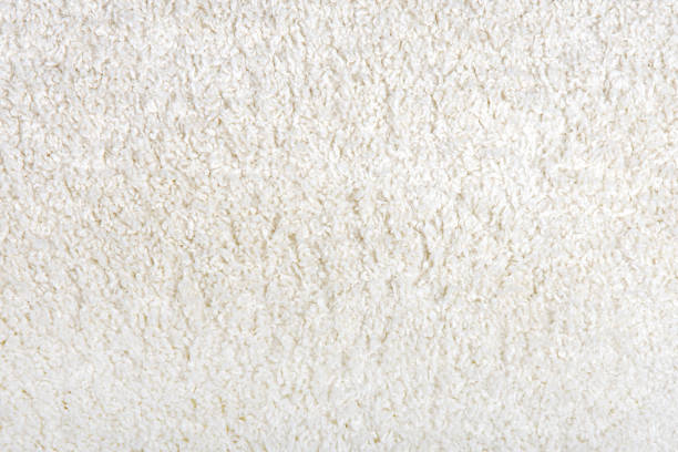 istock Texture of soft white pile carpet. Close-up. Textures. 2190028415