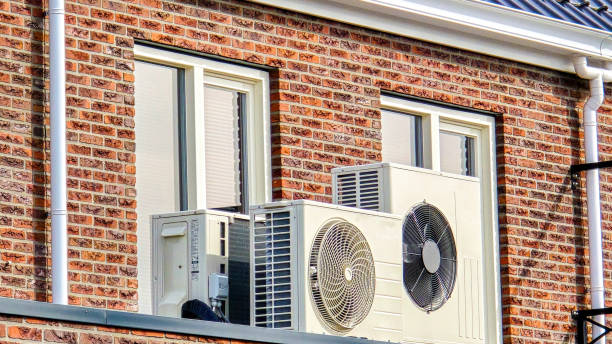 istock air source heat pump unit installed outdoors at a modern home with solar panels in the Netherlands 2190029540