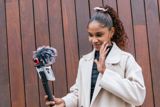 istock Young latin content creator recording a video blog outdoors 2190033545